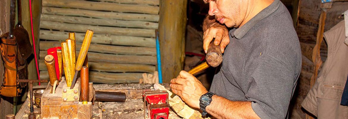 man working on wood orosi valley