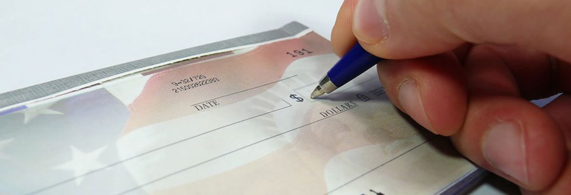 writing a check ira to buy property