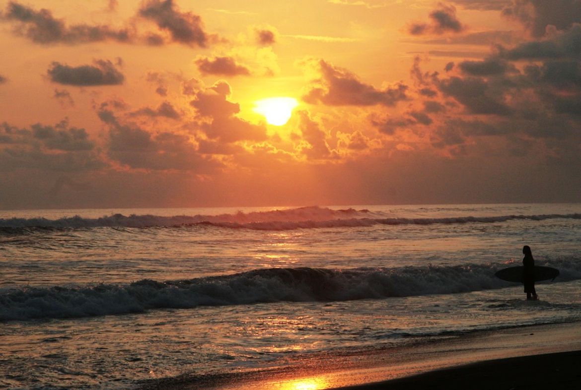 Surfer at Sunset in Dominical