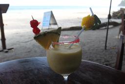 pina colada on beach elancla