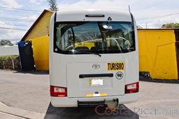 20 passenger coaster van back view