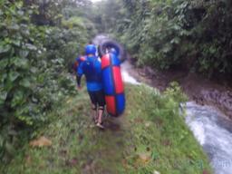 walking along the blue river to start tubing