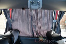 23 passenger volare coach window with curtains closed