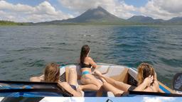 friends admiring the view of arenal volcano from the boat
