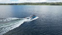 aerial view of a wakesurfing lesson on lake arenal