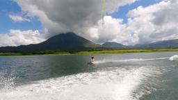 a lady watersking on lake arenal