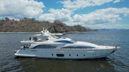 yacht azumit lateral aerial view on the ocean with mountain and sky view