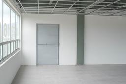 emergency exit on floor located on southern corner