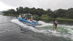 wakeboarding lesson on lake arenal an instructor tells a guest how to do it