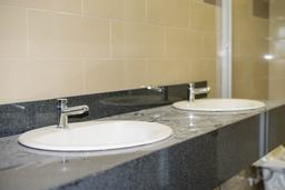 buildling has twin sinks on one bathroom per floor