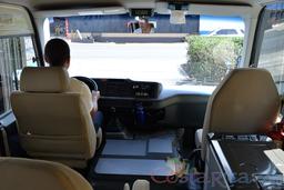 20 passenger coaster van driver and front seat passenger