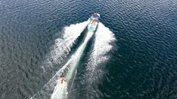 aerial view of people tubing on lake arenal