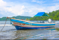 small boat anchored in playa curu curu wildlife refuge 
 - Costa Rica