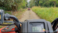 atv nosara tour guide going in front on a dirt trail
 - Costa Rica