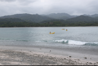 distant kayaks chora island 
 - Costa Rica