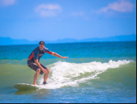 Man Standing On Board Pollo Surf School Matapalo
 - Costa Rica