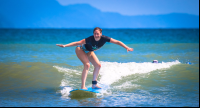 Lady Standing On Board Pollo Surf School Matapalo
 - Costa Rica