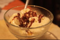 Scoop Of Vanilla Ice Cream And Chocolate Sauce
 - Costa Rica