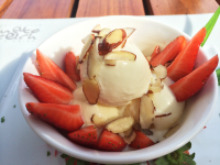        ice cream slivered almonds strawberries gusto beach 
  - Costa Rica