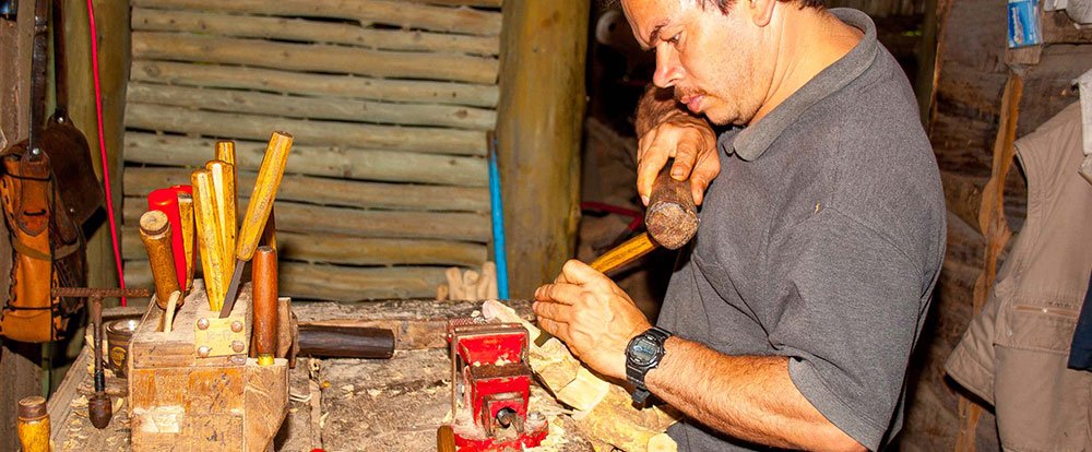 man working on wood orosi valley
 - Costa Rica