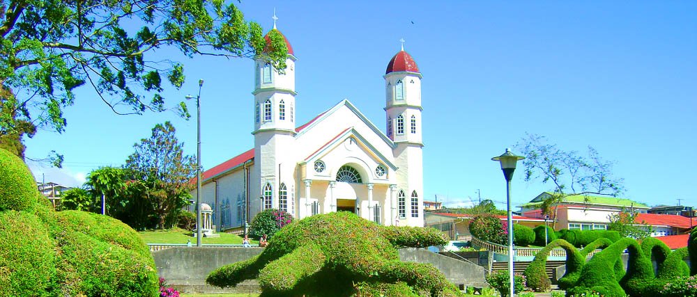        church blue skies zarcero church
  - Costa Rica