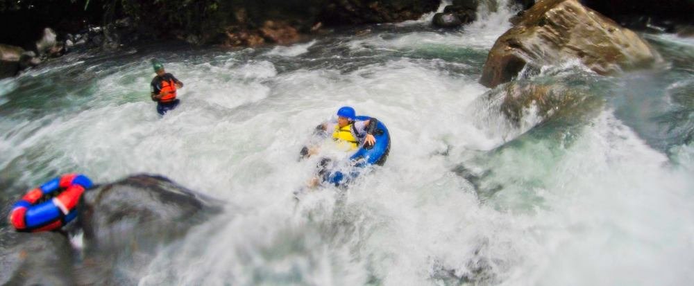 kid tubing in the rapids of blue river rincon de la vieja
 - Costa Rica